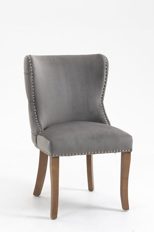 Set of 2 upholstered wing-back dining chair with backstitching nailhead trim and solid wood legs